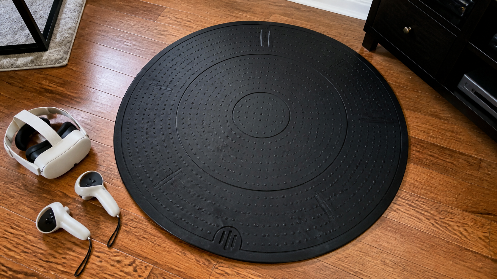 Smartphone photo of a VR mat on a hardwood floor, slightly askew after a vigorous workout session