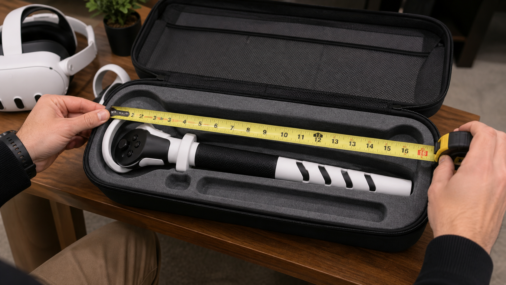 A person uses a tape measure to check the length of a VR Sword attachment against the inside of a VR travel case.