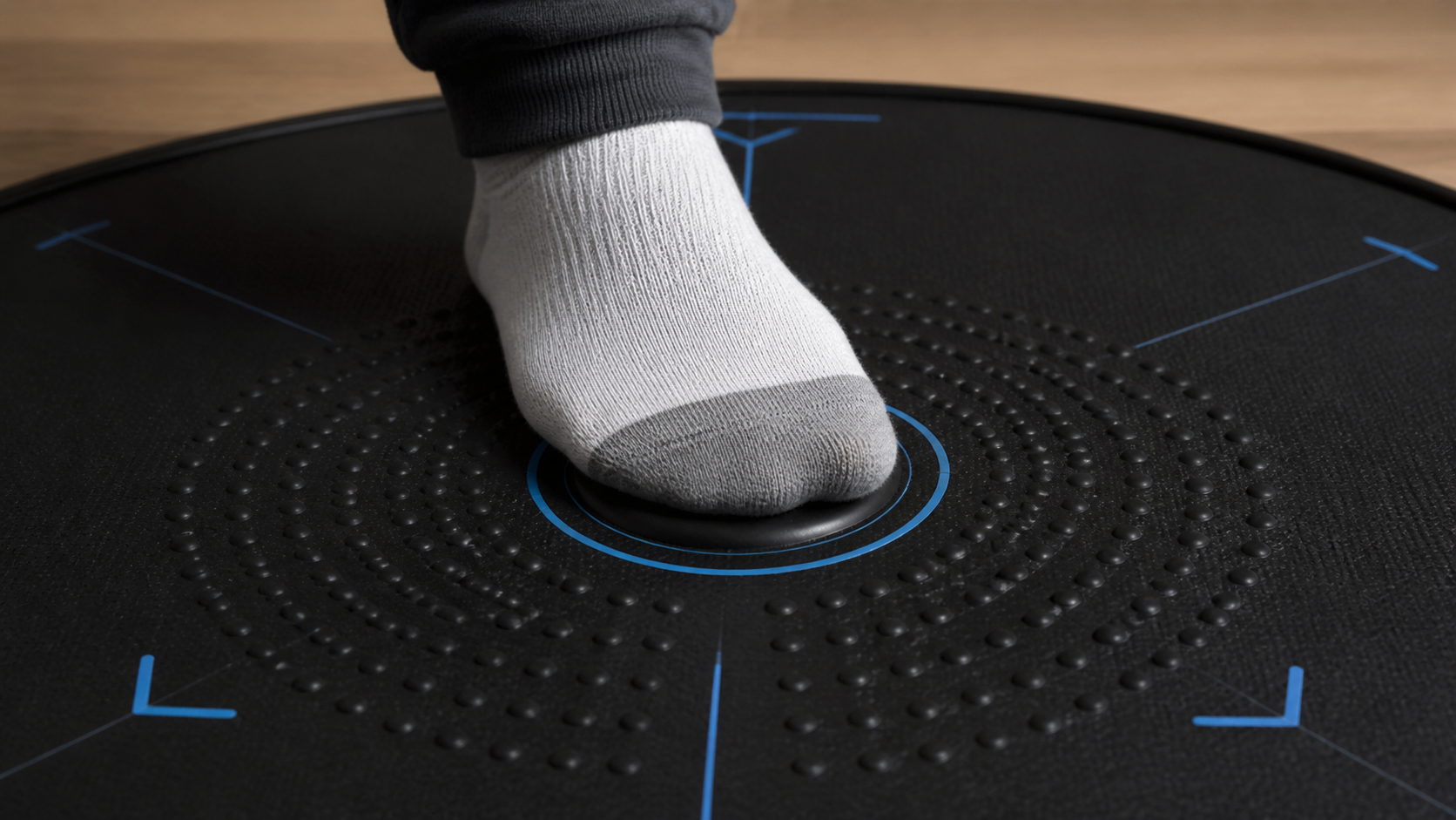 A close-up of a socked foot on a VR mat's center, feeling the raised tactile bump for orientation