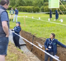 Teagasc staff discussing the importance of soil health via a soil pit demonstration at the Johnstown Castle Open Day