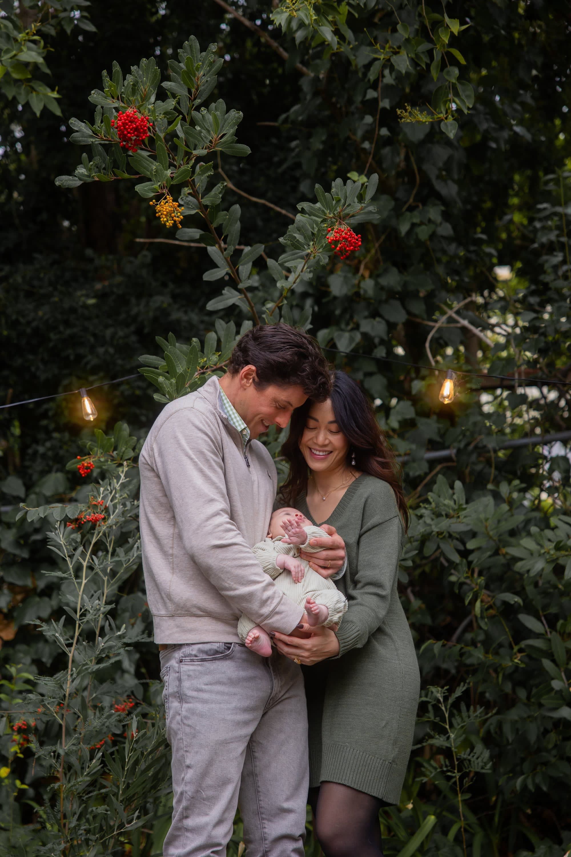 holding baby in backyard