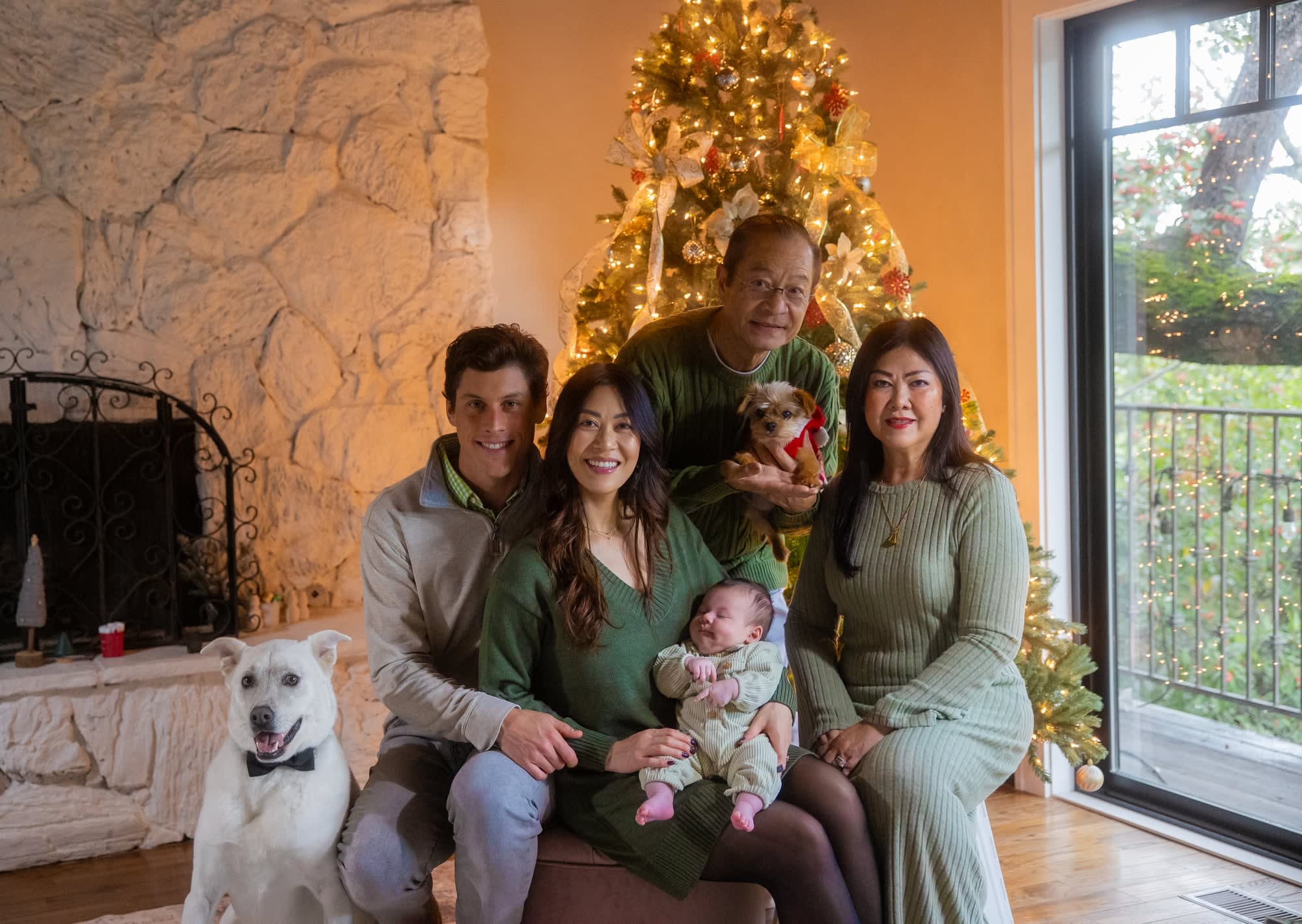 big family photo by christmas tree