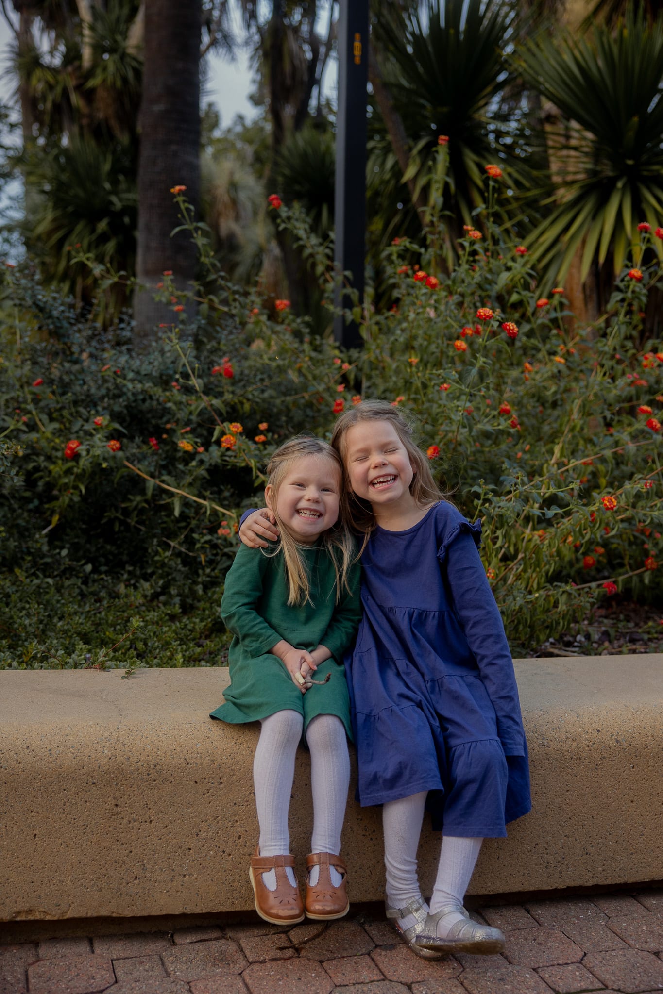 family photo by christmas tree on the floor