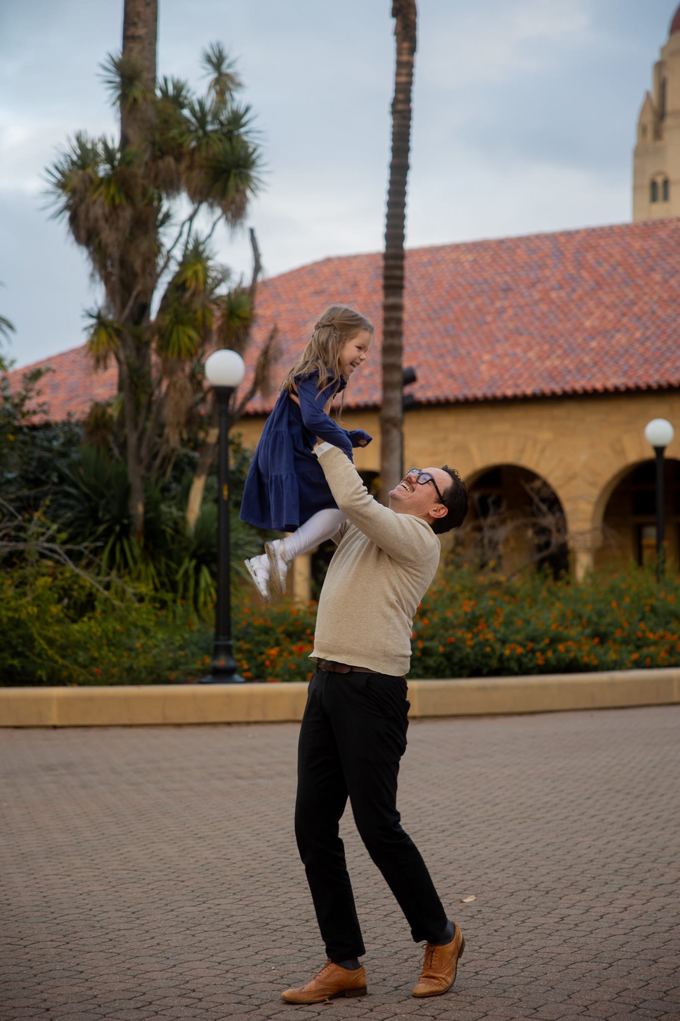 family photo by christmas tree on the floor