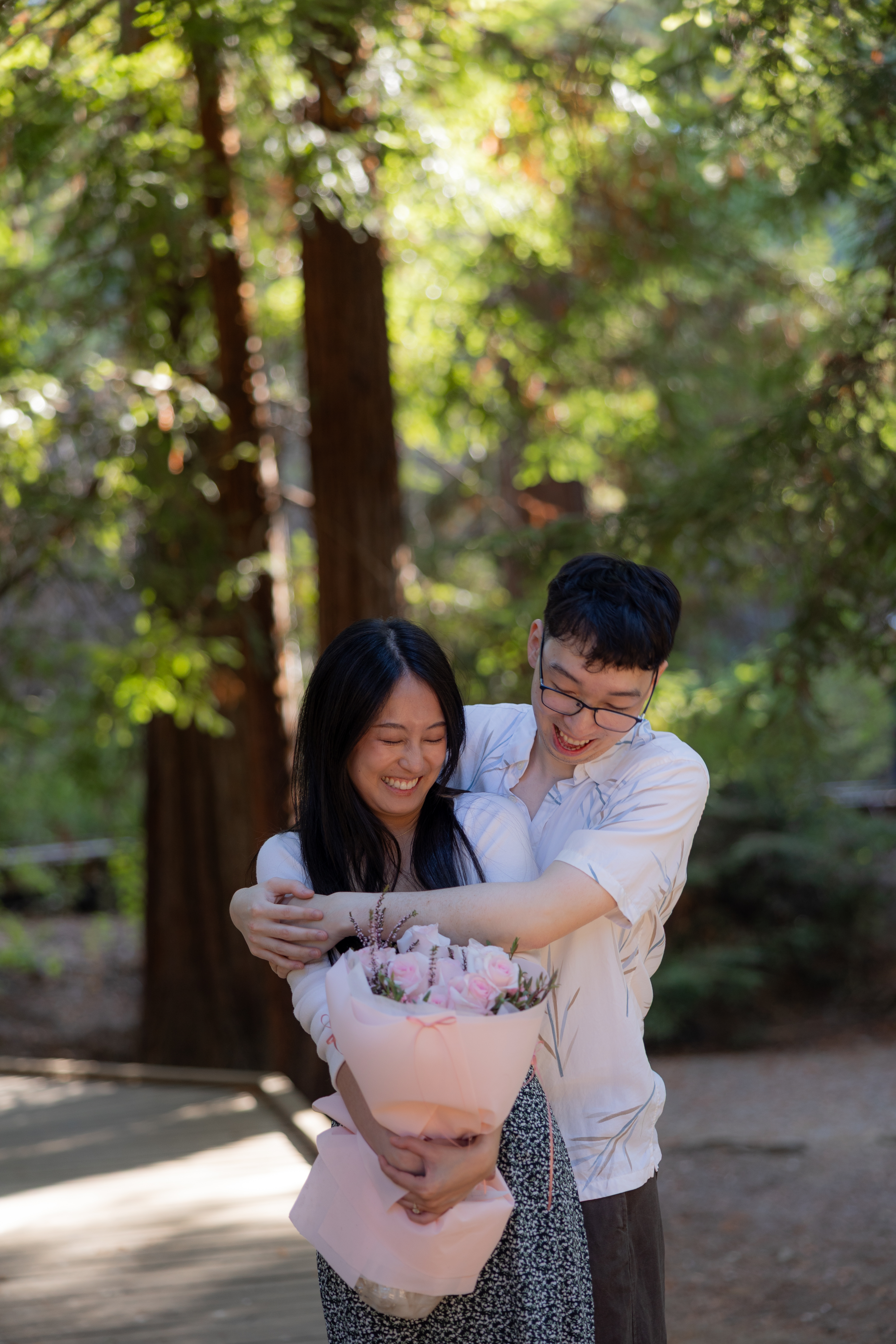 A couple enjoying a redwoods photoshoot