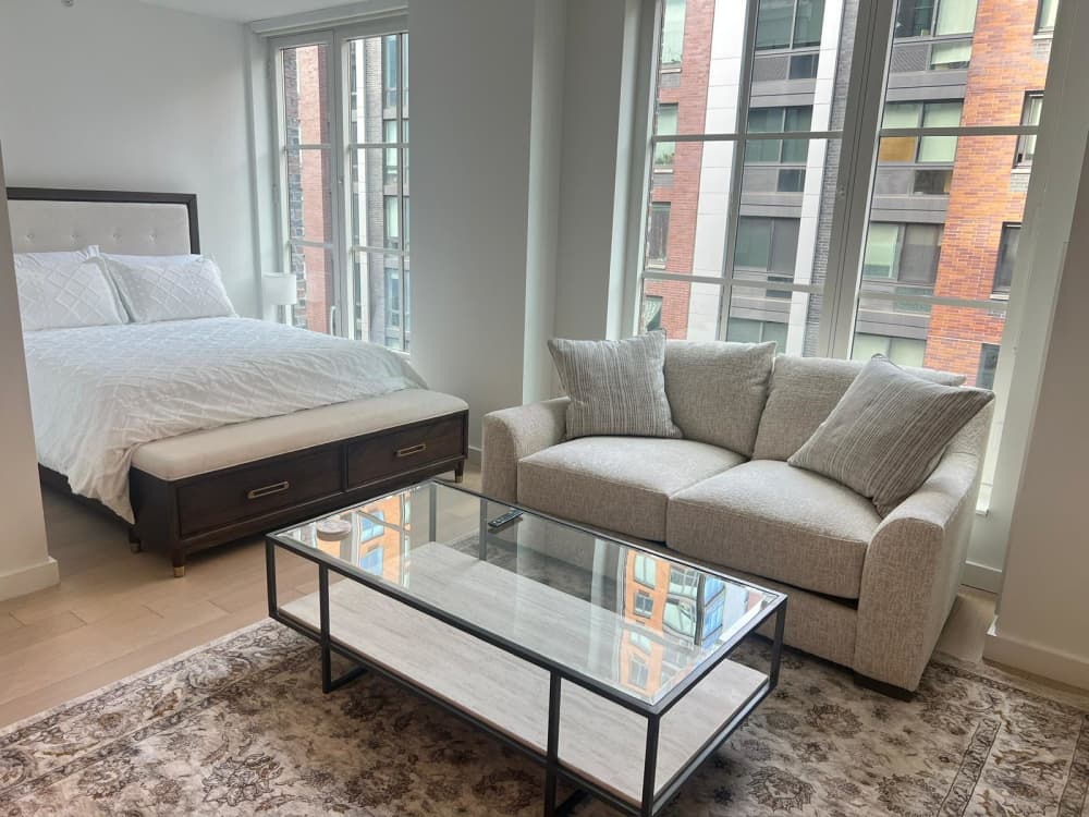 Modern studio apartment with cozy furnishings.