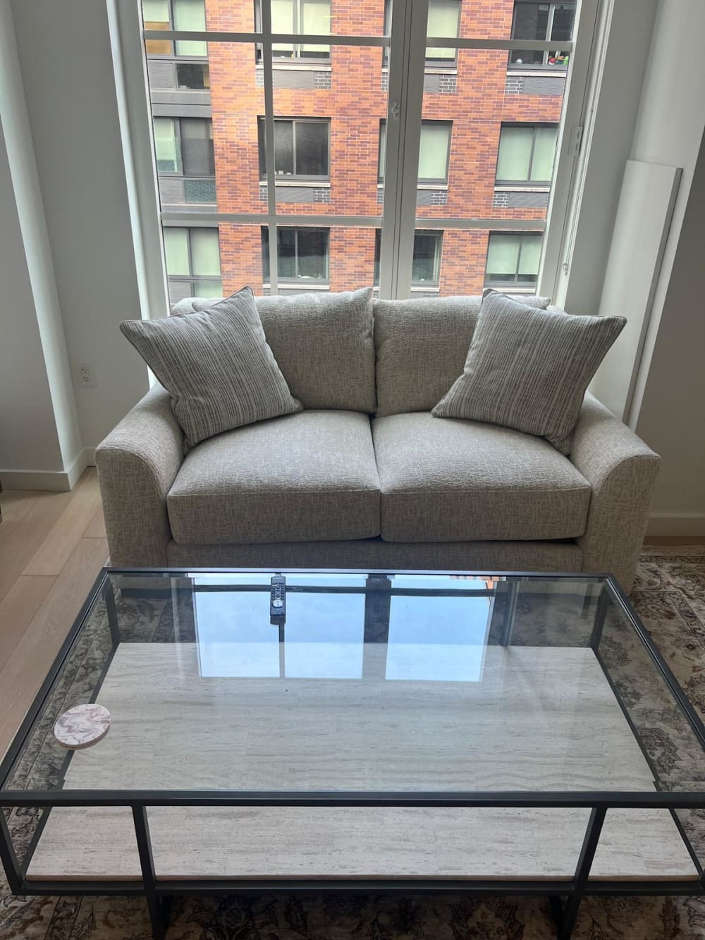 Cozy sofa with glass table.