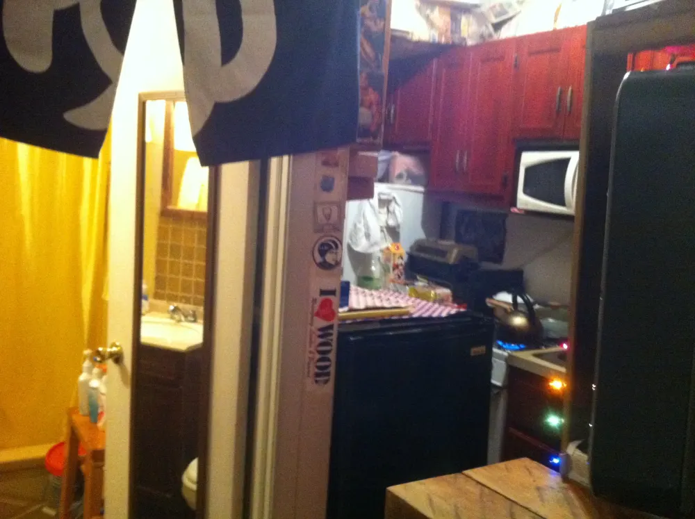 Cozy kitchen and bathroom area.