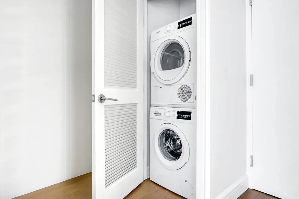 Stacked washer and dryer unit