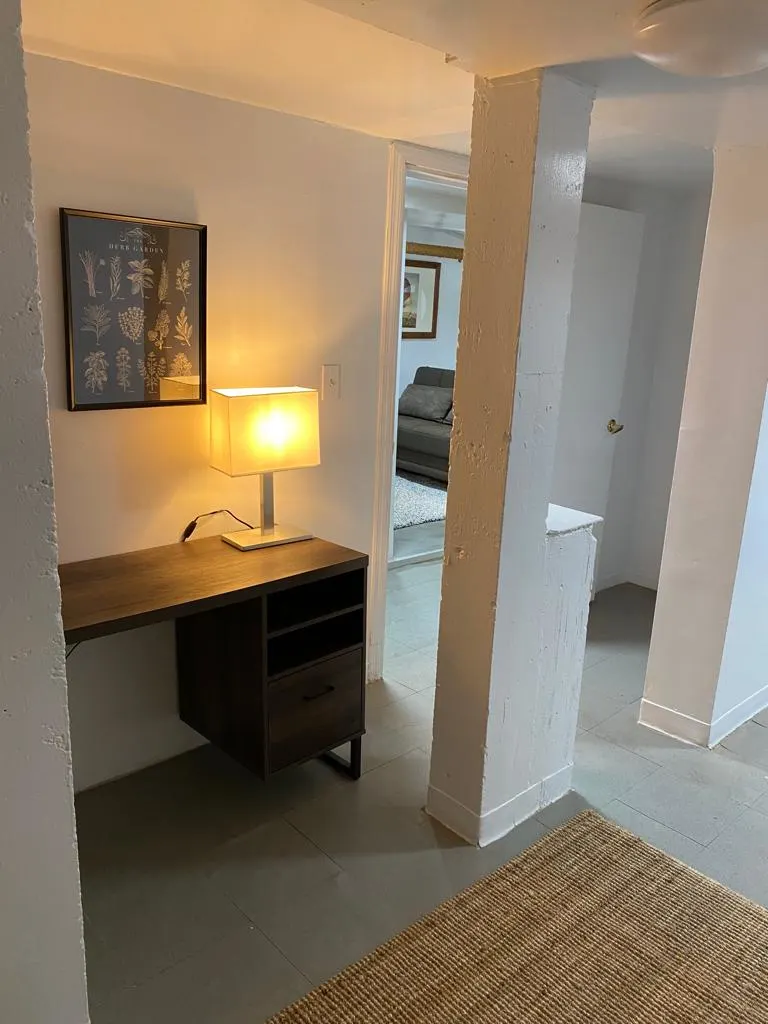 Cozy hallway with desk lamp.