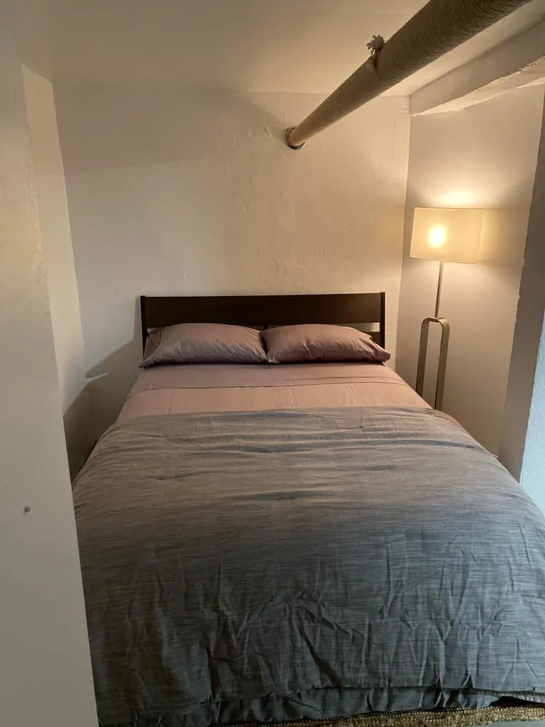 Cozy bedroom with soft lighting.