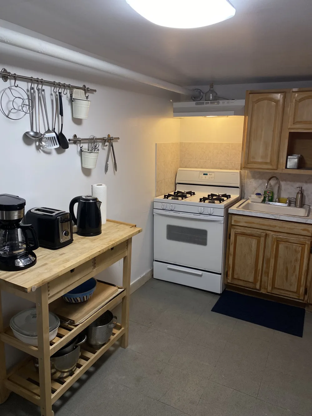 Small minimalist kitchenette with appliances.