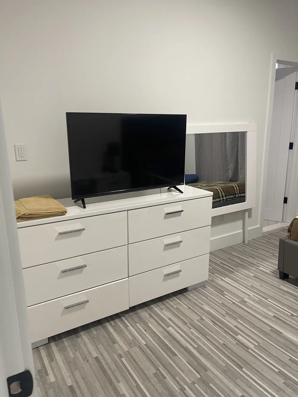 Modern bedroom with TV dresser