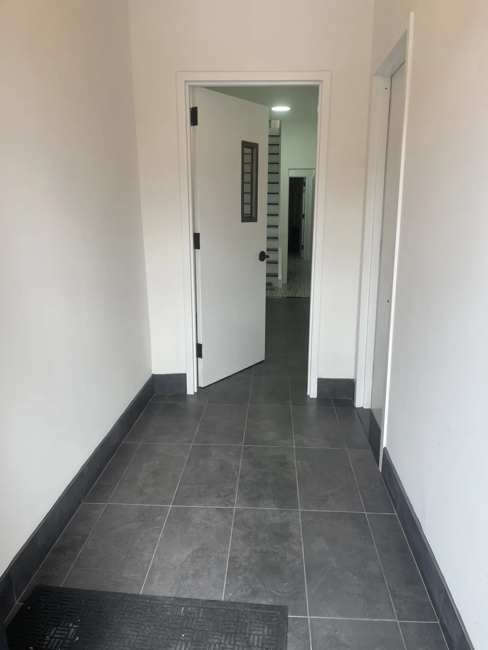 Hallway with open door.