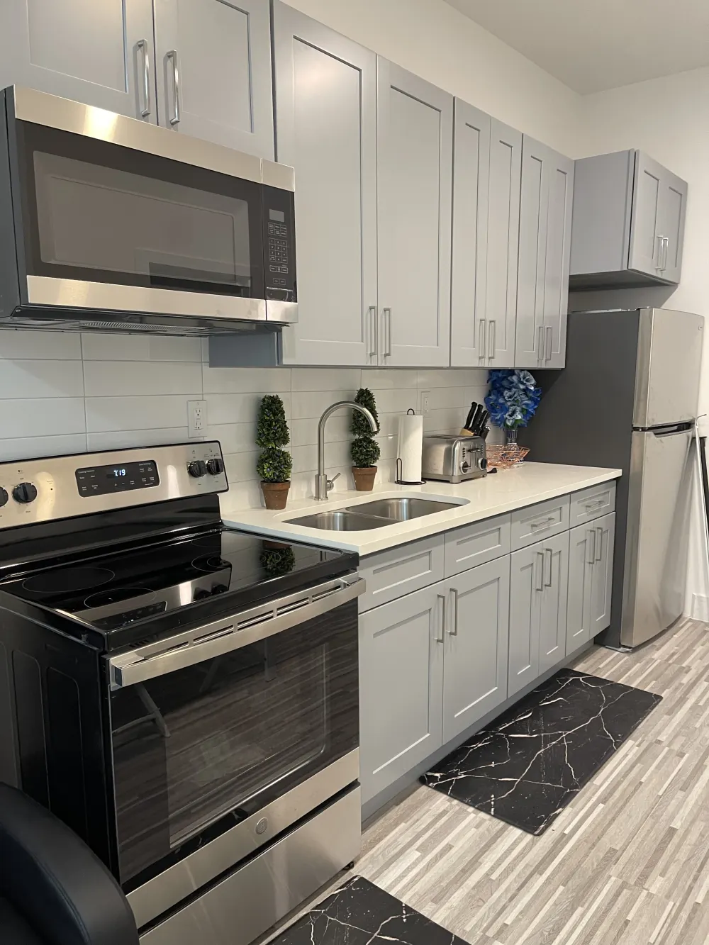 Modern kitchen with stainless steel appliances.