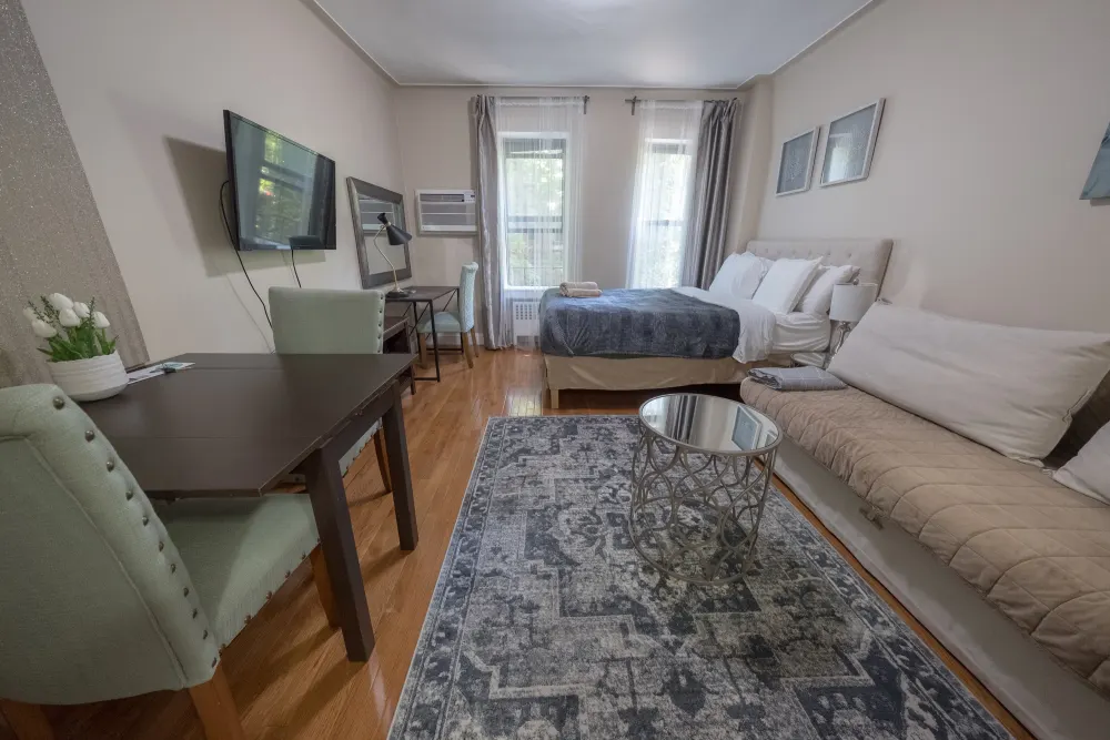 Cozy studio apartment with modern furnishings.
