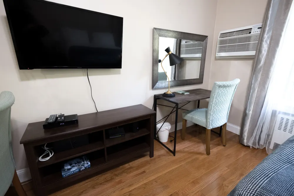 Cozy room with desk setup.