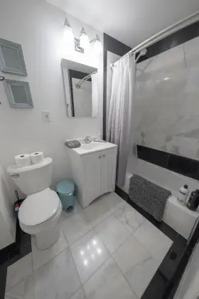 Modern minimalist bathroom with marble details.