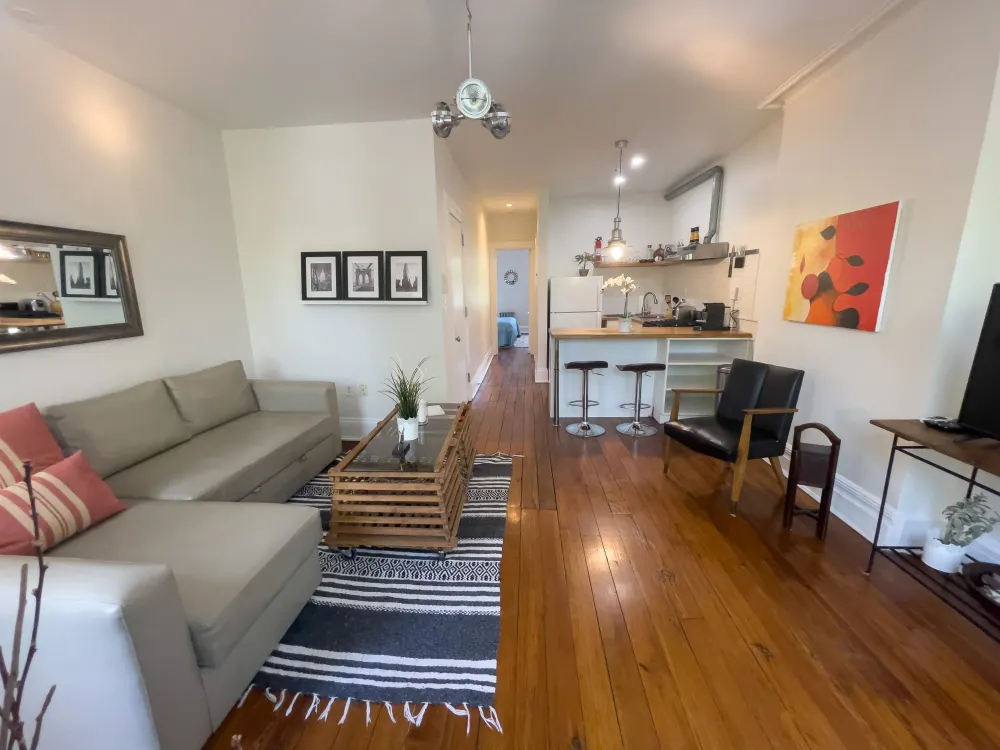 Modern living room with open kitchen.