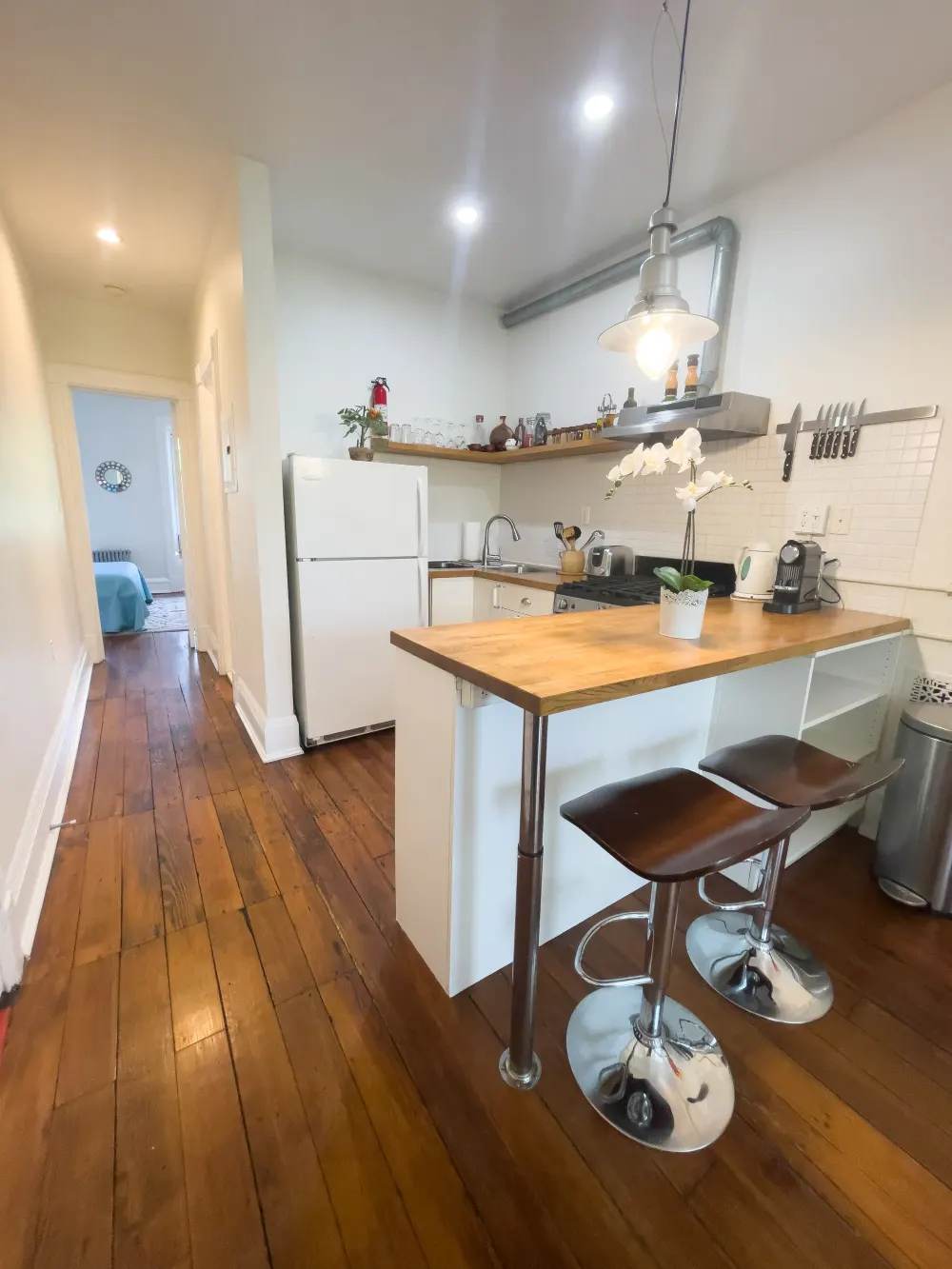 Cozy kitchen with wooden floors.