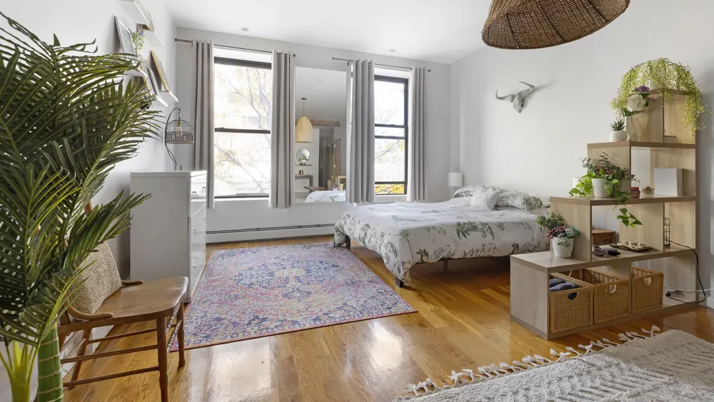 Bright, airy bedroom with plants.