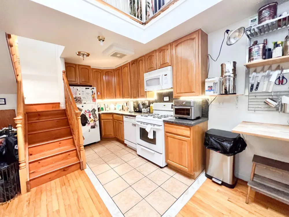Cozy kitchen with wooden cabinets.
