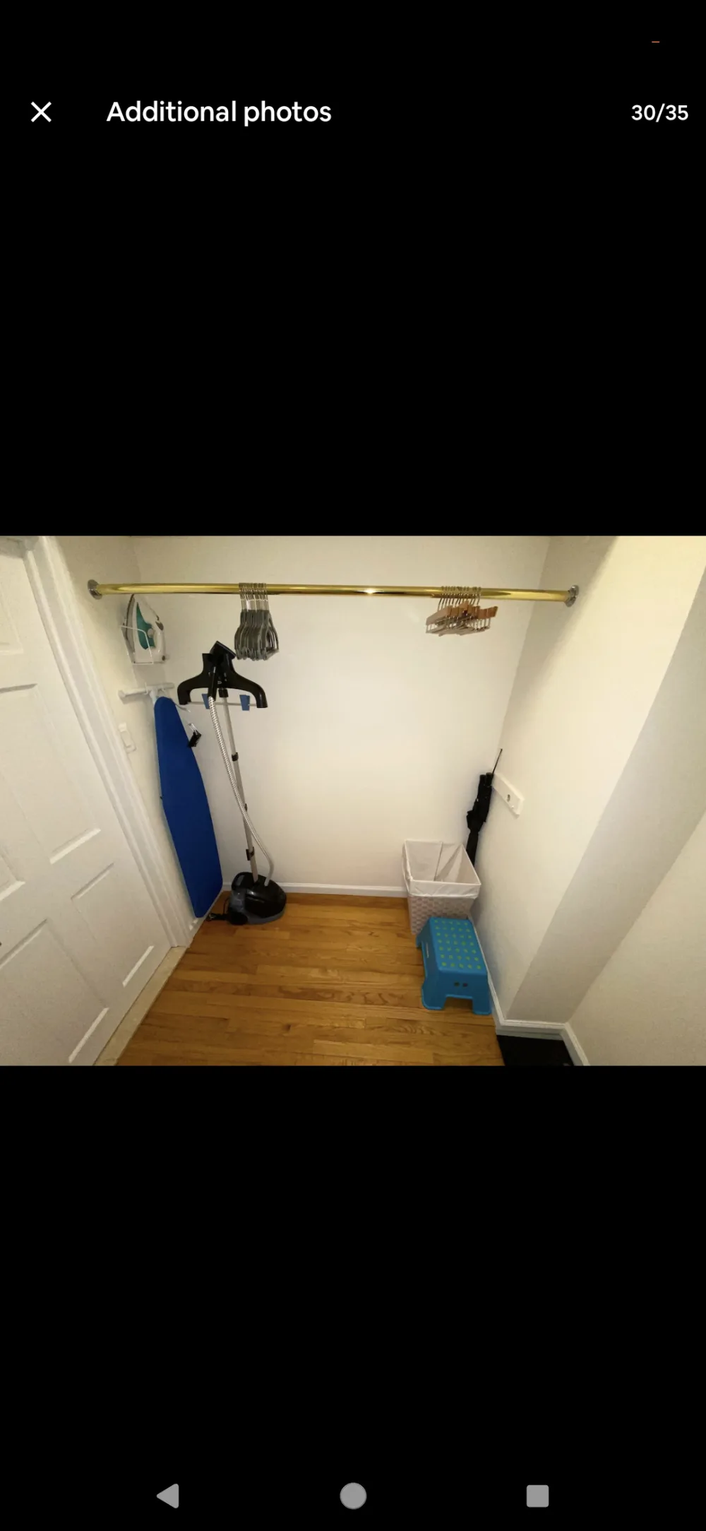 Closet with hangers and essentials.