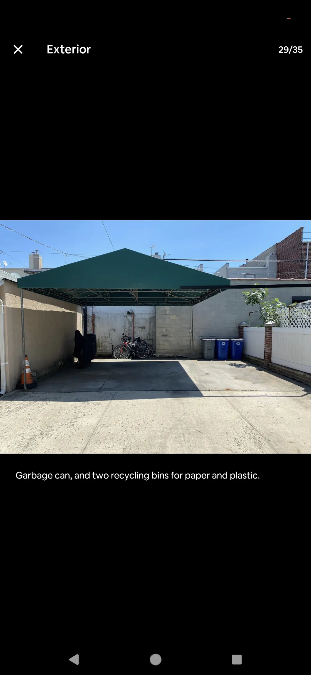 Covered parking area with bicycles.