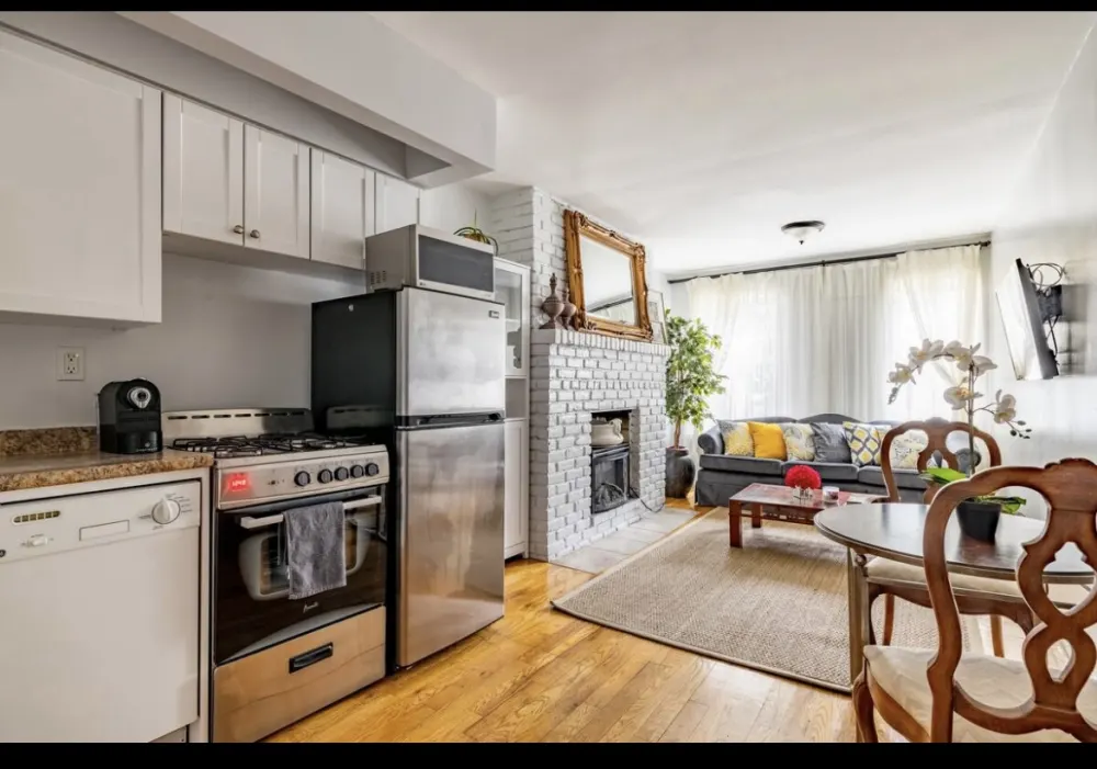 Cozy living room with kitchen.