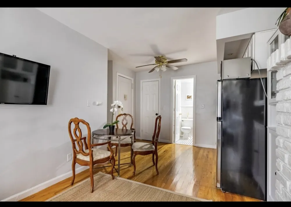 Cozy dining area with kitchenette.
