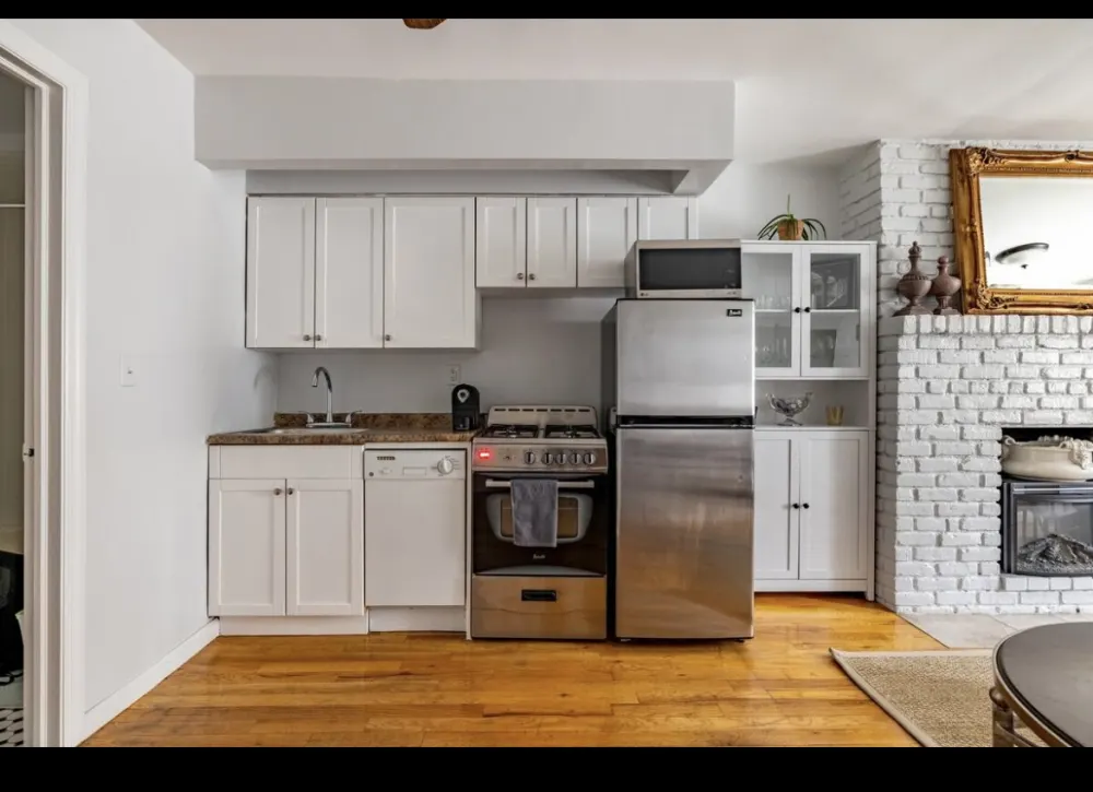 Modern kitchen with white cabinets.