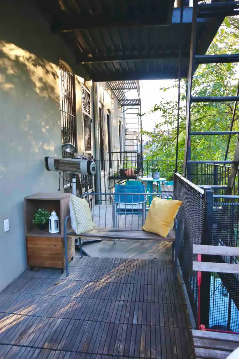 Cozy apartment balcony with seating.