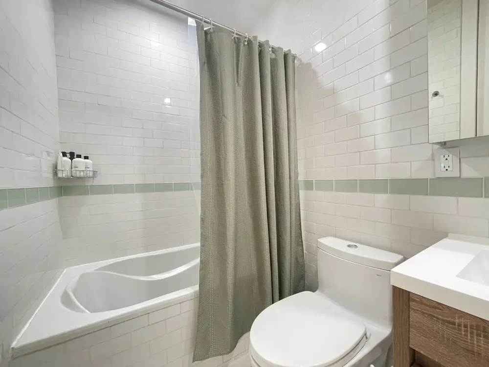 Modern bathroom with tiled walls.