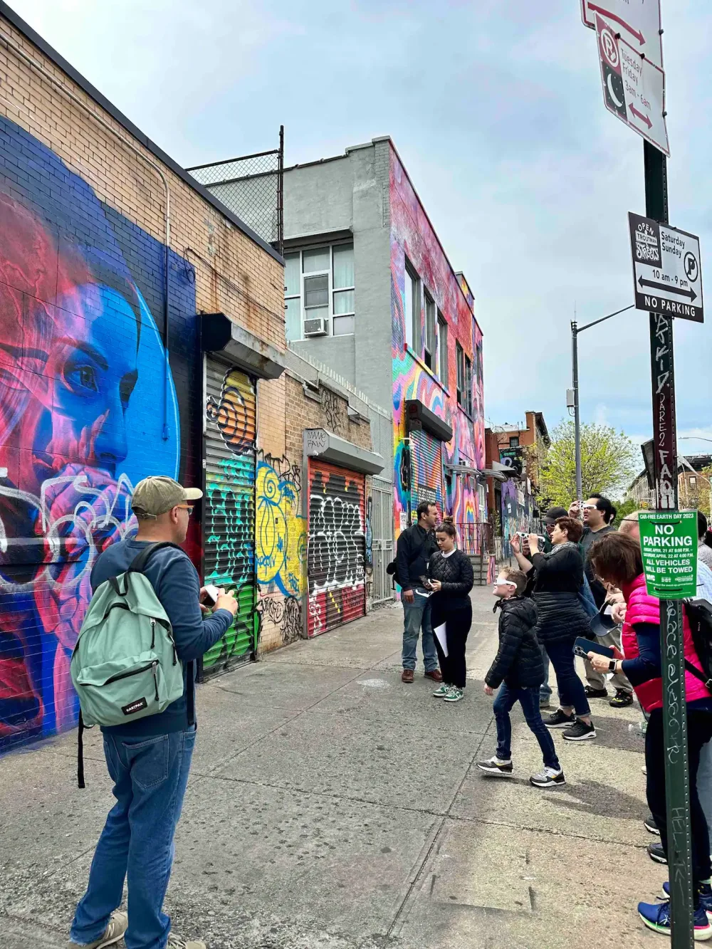 Group admiring vibrant street art.