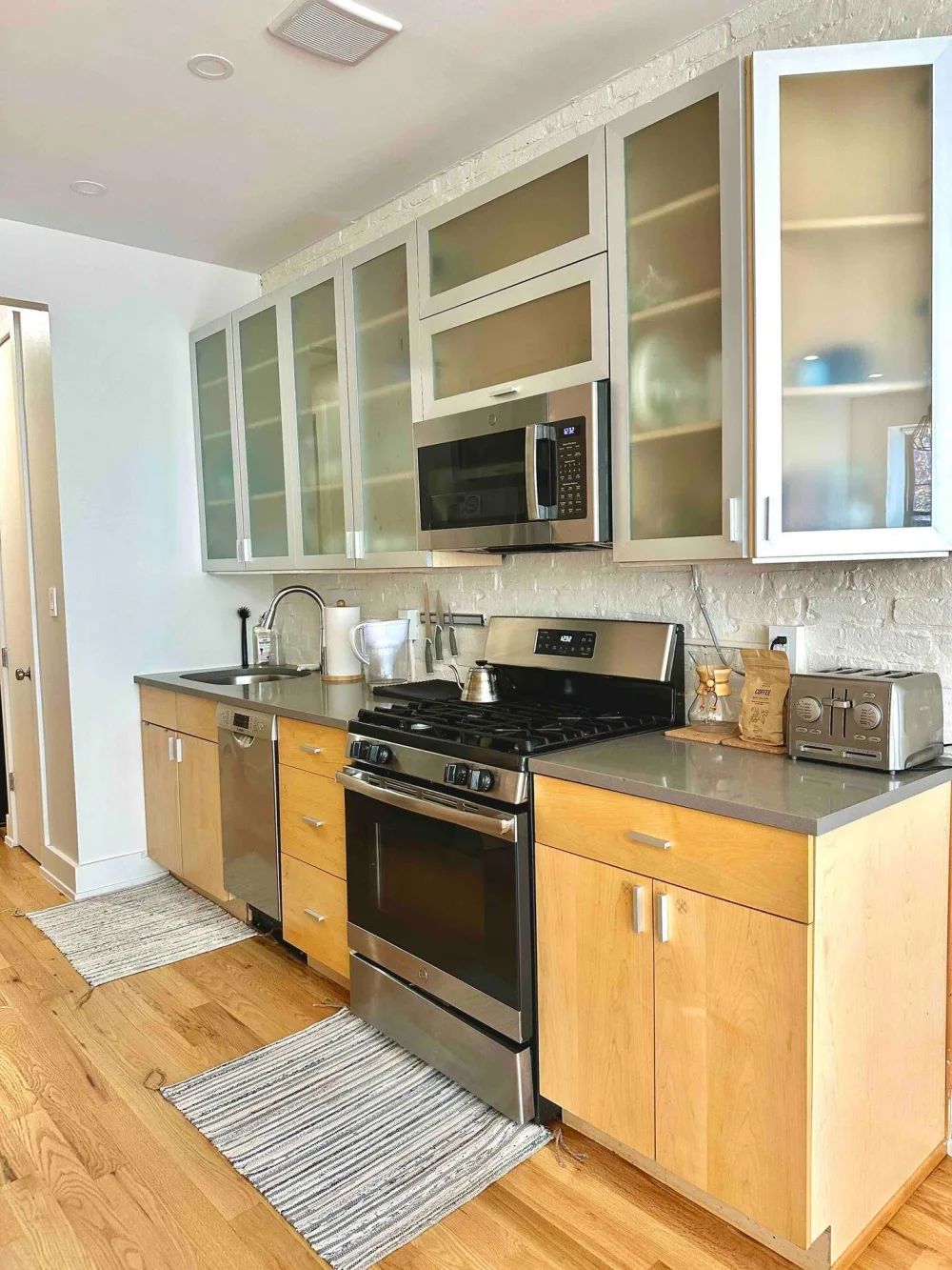 Modern kitchen with stainless steel appliances.