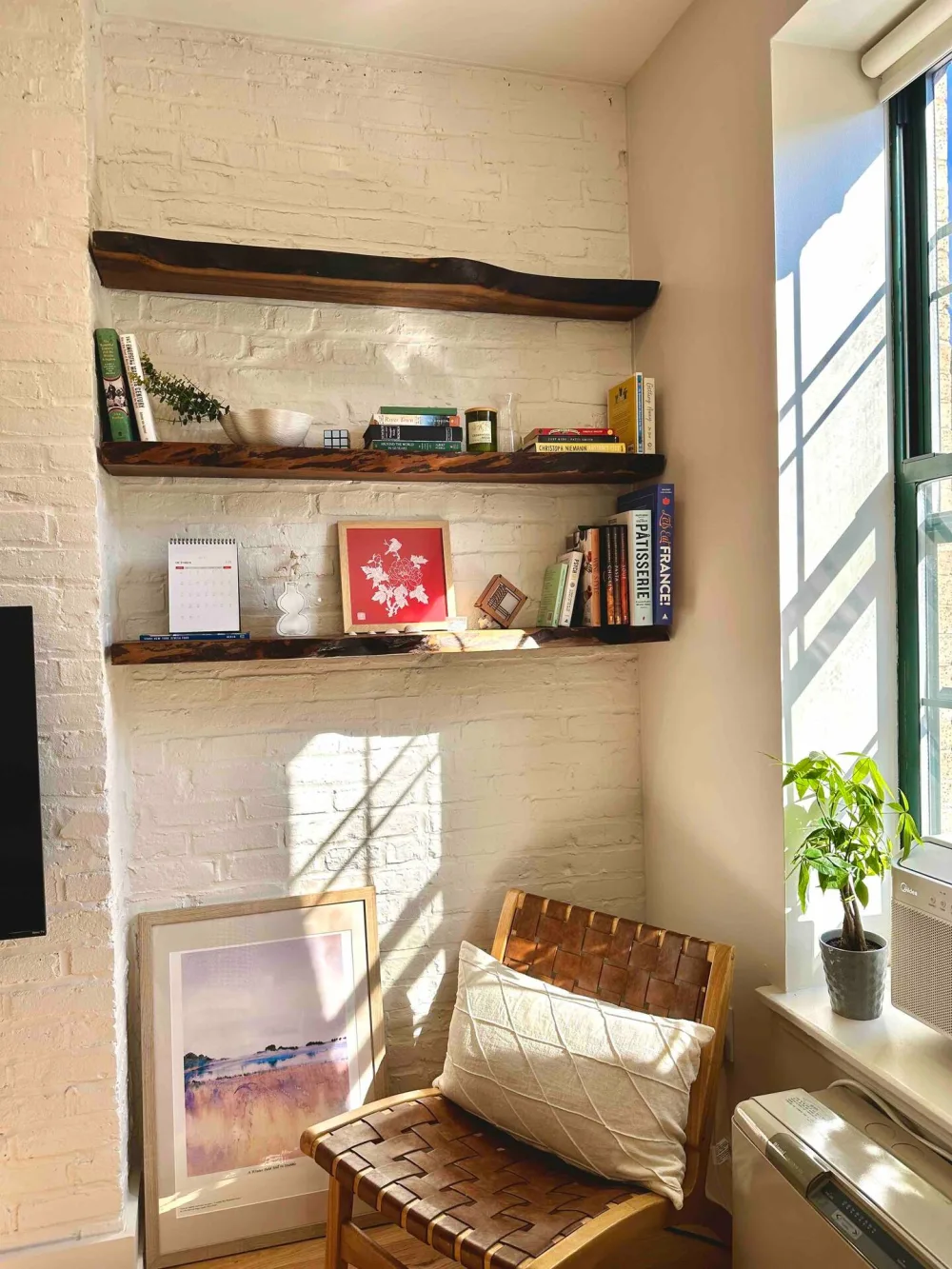Cozy nook with decorative shelves.