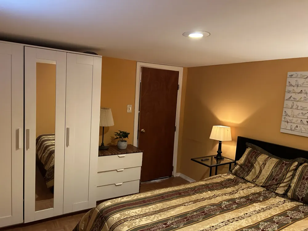 Cozy bedroom with warm lighting.