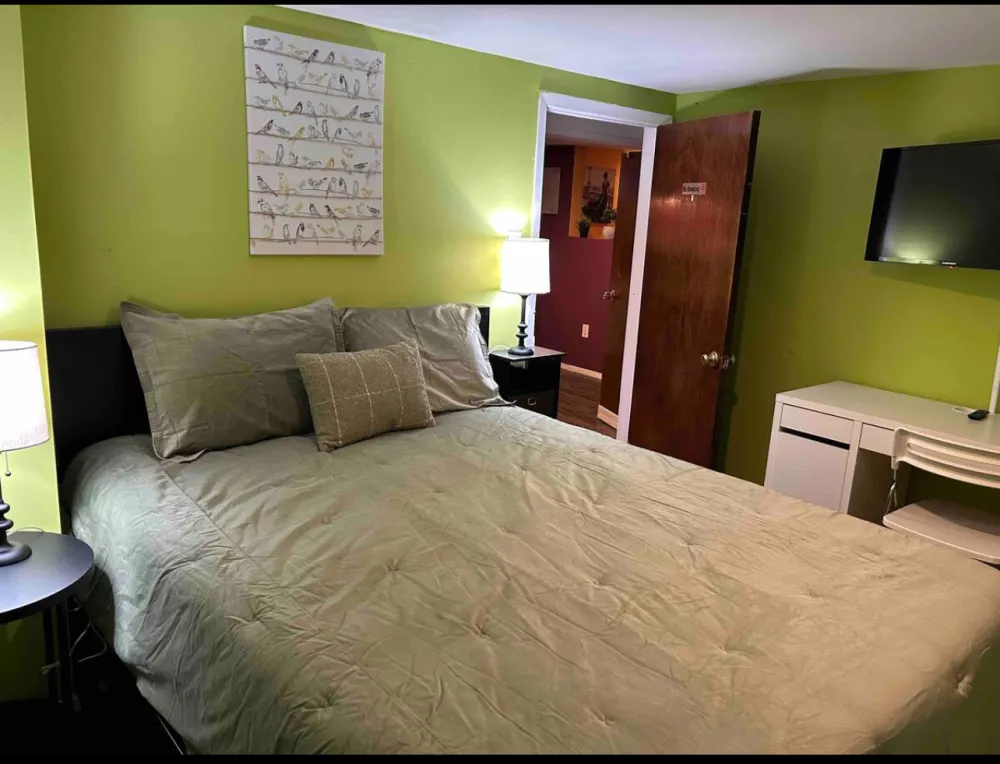 Bright room with a cozy bed.