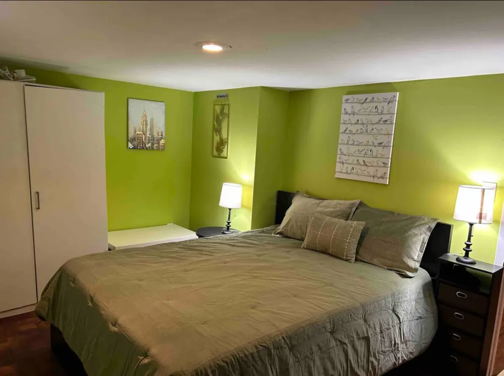 Cozy bedroom with green walls