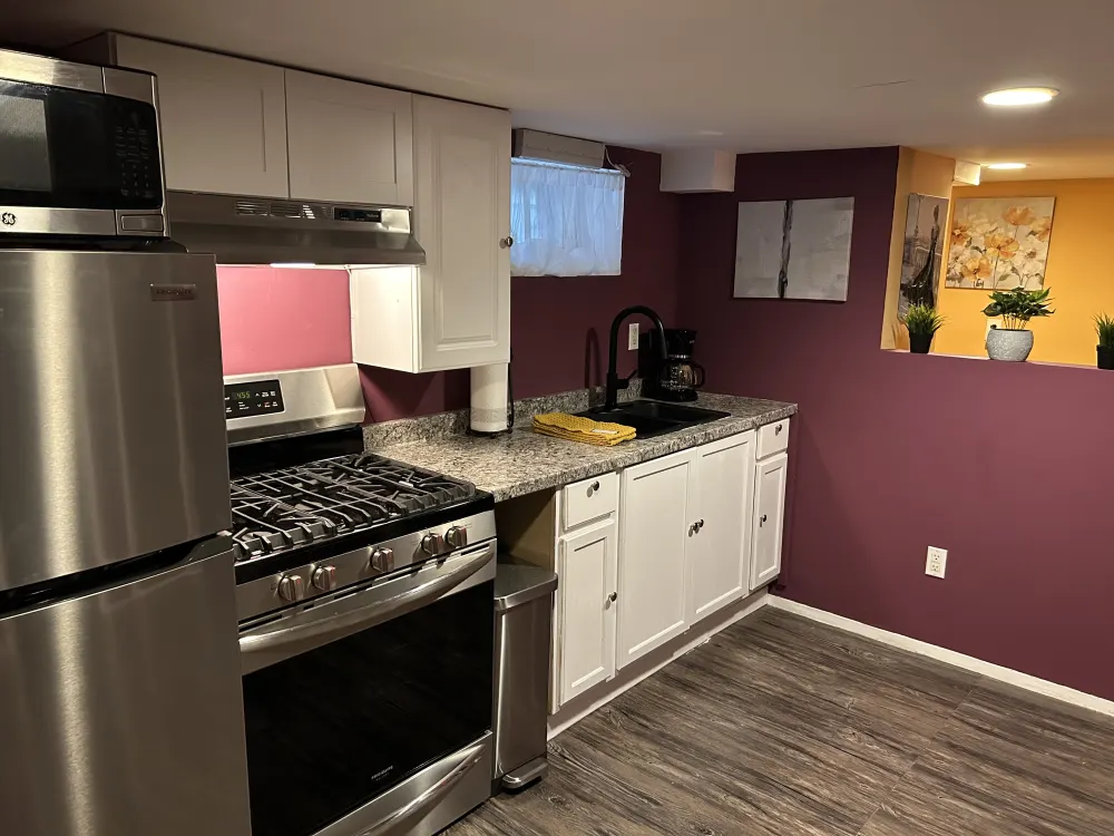 Modern kitchen with stainless steel appliances.