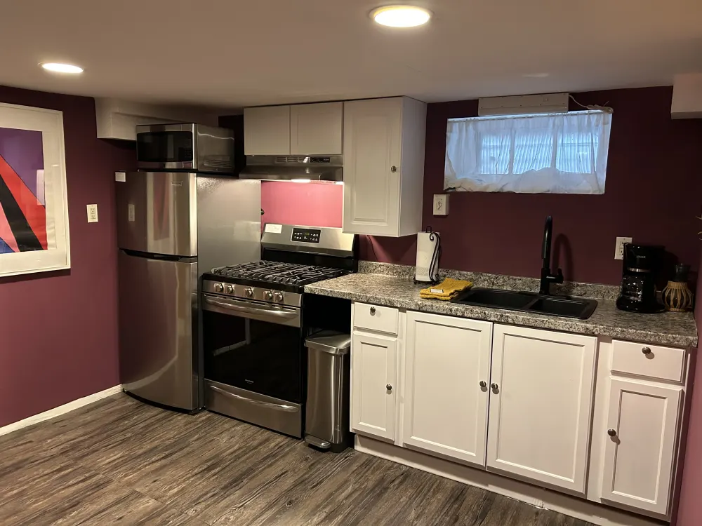 Modern kitchen with stainless steel appliances.