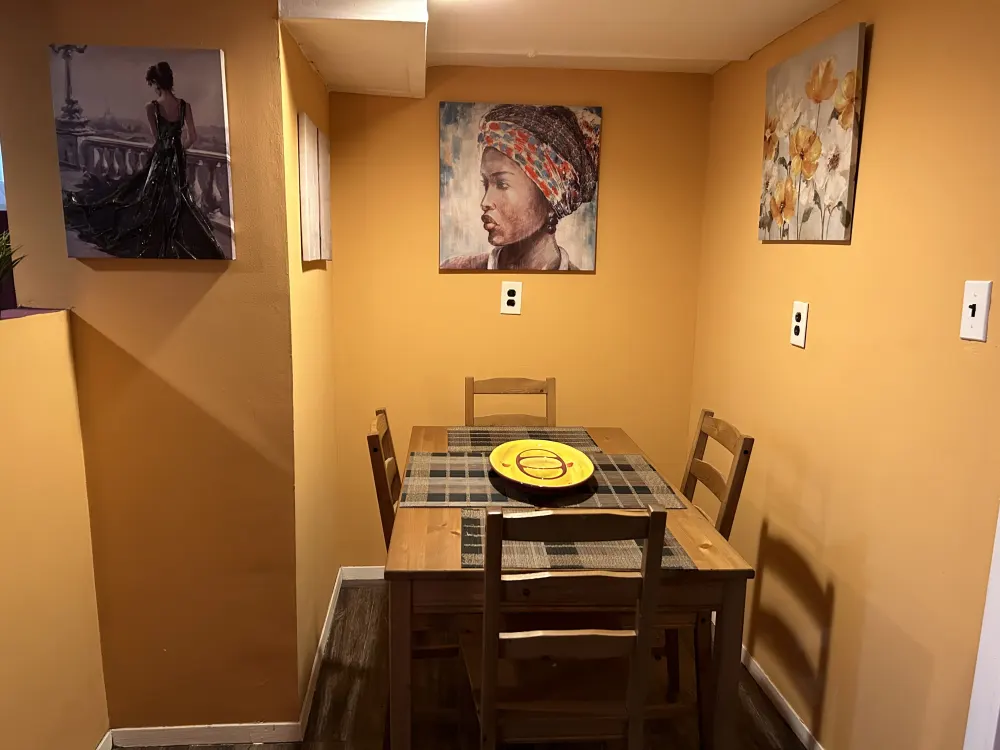 Cozy dining area with art.