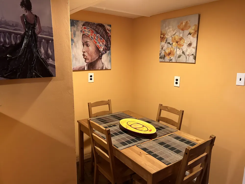 Cozy dining area with artwork.