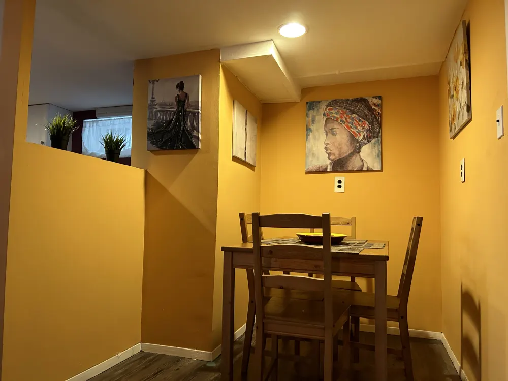 Cozy dining nook with artwork.