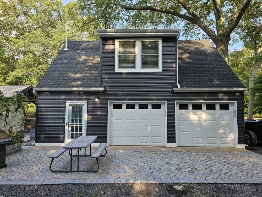 Dark house with double garage.