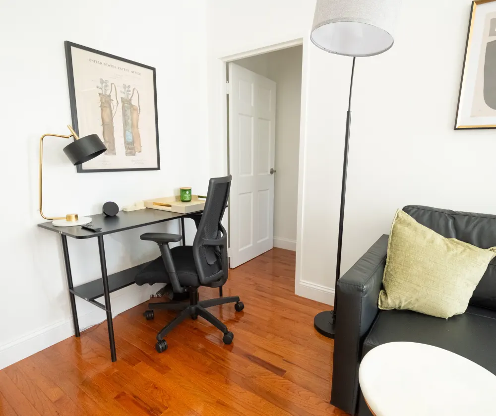 Modern home office with artwork.