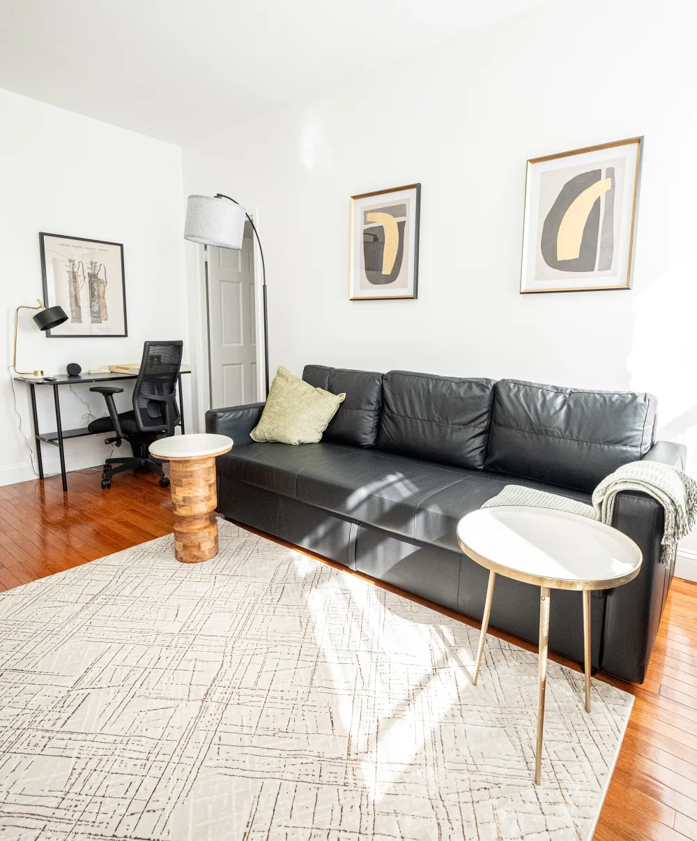 Modern living room with workspace.