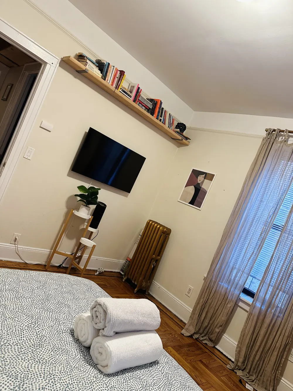 Cozy bedroom with rolled towels.