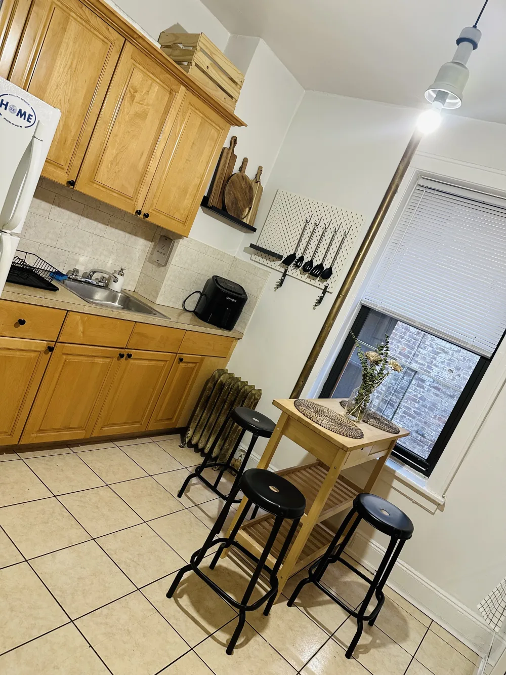 Cozy kitchen with wooden cabinets.