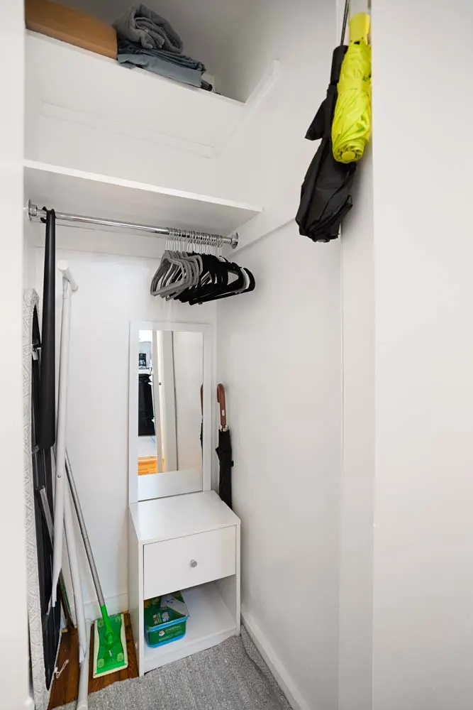 Small wardrobe with hanging rod.